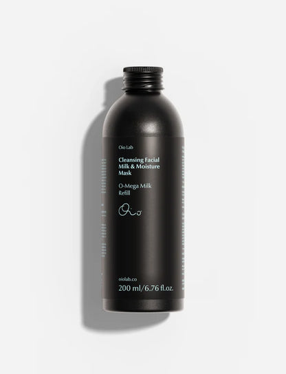 Aluminum refill bottle of Oio Lab Cleansing Facial Milk &amp; Moisture Mask refill, shown against a light gray background with a soft shadow.