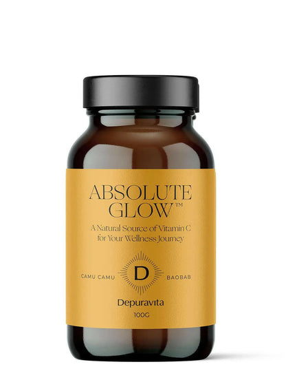 Brown bottle with yellow label containing Absolute Glow dietary supplement by Depuravita.