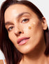Close up of glowing complexion achieved with HOLITINT botanical tinted serum