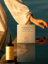 Deeper Vita supplement box with bottle on a reflective water surface