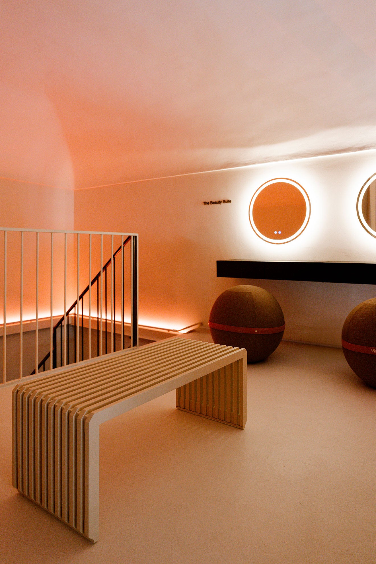 CHB Holistic Studio treatment room with minimal aesthetic, natural materials, and chromotherapy lighting.